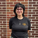 front of black tee with orange "Two Hearted Ale" on the left pocket area