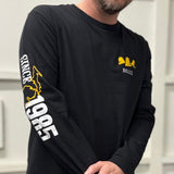 black long sleeve tee shirt featuring yellow Bells logo with white text "Bells" beneath on pocket. "Since 1985" printed in white on right sleeve with outline of Michigan in yellow. A yellow star is in place of Kalamazoo on the map.