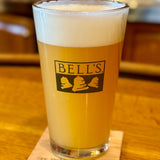 Clear pint glass featuring Hazy Hearted IP can art in yellow and navy.