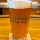 Clear pint glass with green Two Hearted fish and a green Bell’s logo.