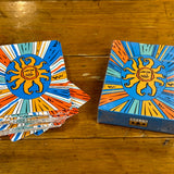 Oberon themed deck of playing cards featuring a sunburst design with orange, blue, yellow, teal, and white around the Oberon sun.