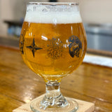 Clear snifter glass with OriginAles text across the lower third and Bell's logo in middle third. Black illustrations of various beer logos around the glass.