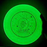 glow in the dark green ultimate disc with Oberon Eclipse logo in metallic blue with circular star pattern framing