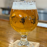 Clear snifter glass with OriginAles text across the lower third and Bell's logo in middle third. Black illustrations of various beer logos around the glass.