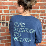 Navy Long Sleeve Tee with the Oberon Eclipse logo on the left chest. On the back the writing says "its polite to stare".