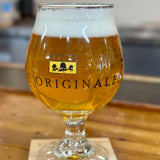 Clear snifter glass with OriginAles text across the lower third and Bell's logo in middle third. Black illustrations of various beer logos around the glass.