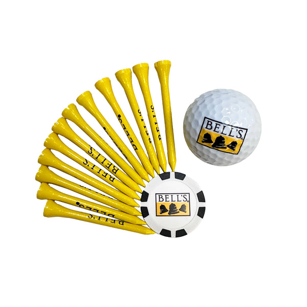 12 Yellow golf tees with black Bell's Logo in a radial pattern around black and white ball marker with yellow, black and white Bell's Logo. A white golf ball with the Bell's yellow, black and white logo in the top right.