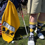 Golden yellow golf towel with Bell's Logo and Inspired Brewing printed on it.