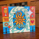1000 piece puzzle featuring a design that incorporates the Oberon brand logo and beer glasses, hearts, the year 1992, waves, all in the color palette used for Oberon. Orange, gold, blue and sea foam green