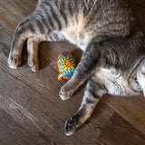 orange stuffed Oberon cat toy in the shape of and featuring the Oberon full color sun logo