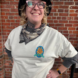 Person wearing a white shirt with full color Oberon logo on pocket area logo
