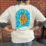 white t-shirt with a colorful blue and teal wave pattern with full color Oberon sun large on back