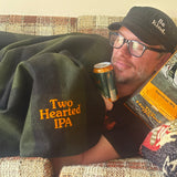 Green buffalo check wool blanket with orange embroidered "Two Hearted IPA on bottom right corner