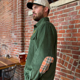 green corduroy button up shirt with orange plaid elbow patches and embroidered "Two Hearted IPA" over pocket.