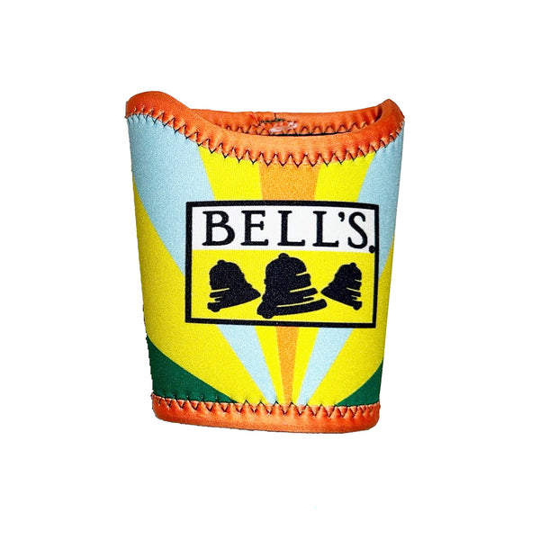 Pint coozie featuring a starburts of colors, including green, yellow, light blue, and orange. Has orange accent trim on top and bottom with green contrast stitching. Features Bell's logo in black, white and yellow.