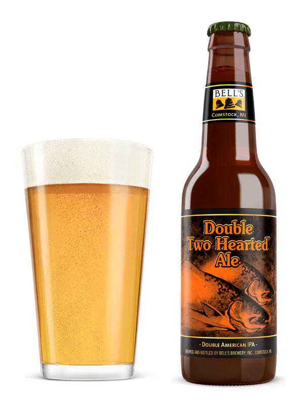 Brown glass bottle of Double Two Hearted Ale next to a pint glass of beer.