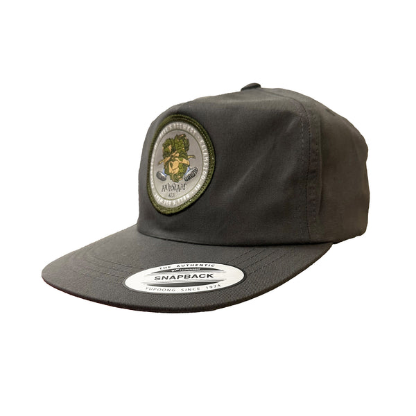 Grey flatbrim hat with circular patch featuring Hopslam logo with green border