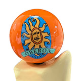 Zoom in of the Bell's Brewery beer tap handle with a orange globe with the Bell's Oberon logo