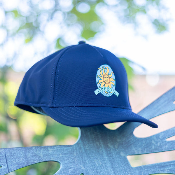 Navy blue flexfit baseball cap with Oberon logo embroidered on the front.