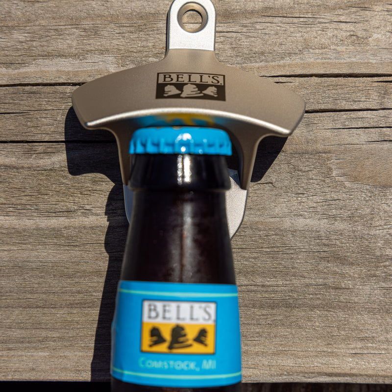 Steel bottle opener for wall mount with black Bell's logo printed on the upper portion