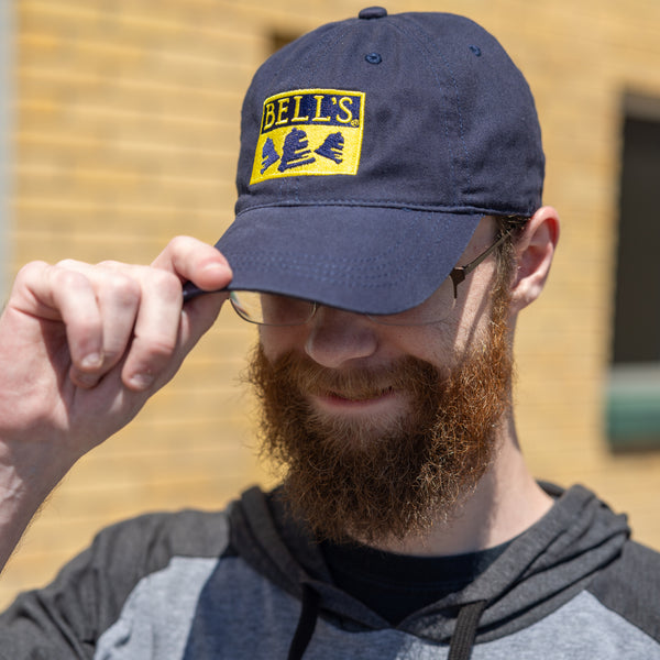 Navy blue dad hat with golden yellow Bell's logo embroidered on the front