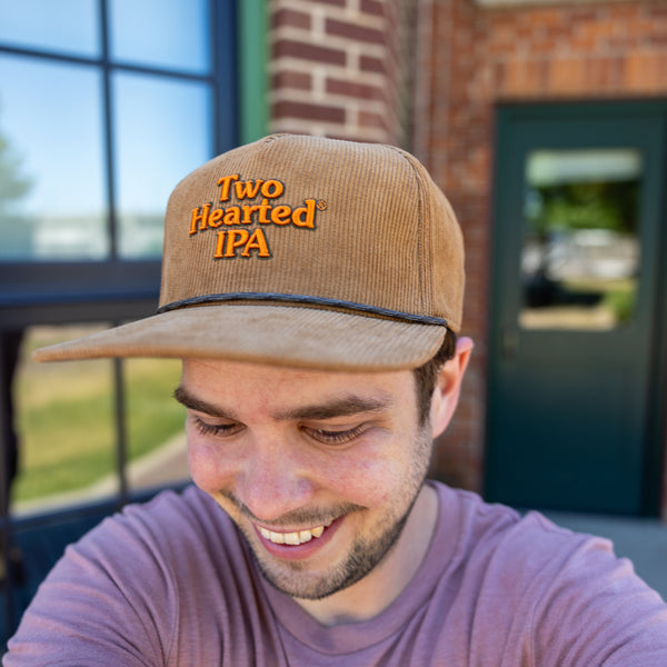 Brown corduroy flat brimmed cap with embroidered Two Hearted IPA logo in orange and multi-tone cord around the brim.