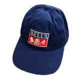 Navy blue dad hat with Bells logo in the center.  The lettering, bells, and the outlining box are white, and the bottom half of the box is red.