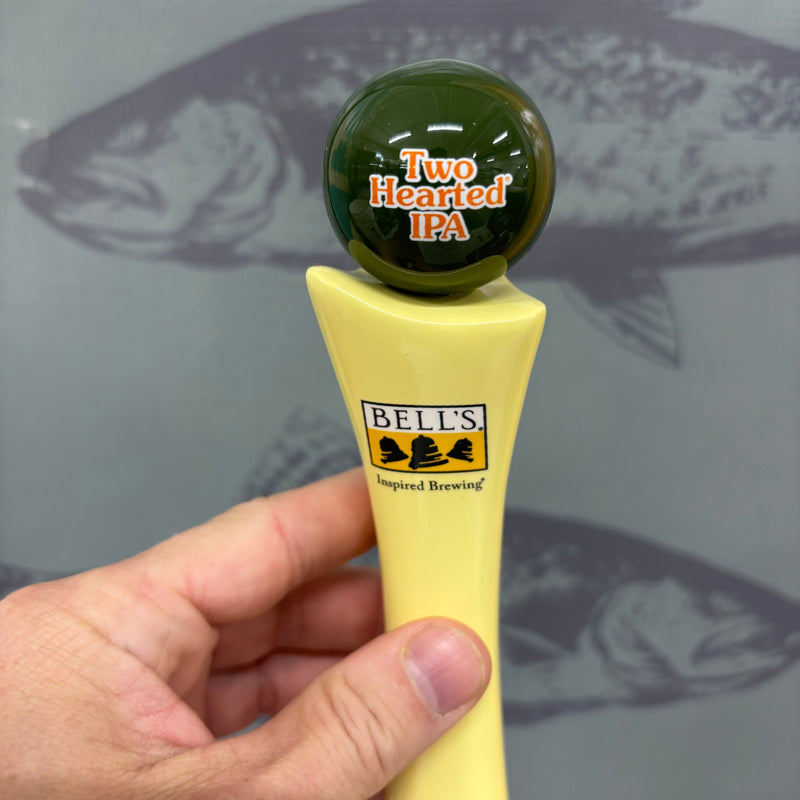 bone style tap handle base with Bell's Logo at the top with a dark green globe fixed to the top featuring "Two Hearted IPA" in orange letterered outlined in white