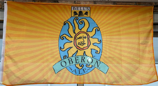 Yellow and orange sun burst patterned 3x5ft nylon flag with full color Oberon logo in the center.