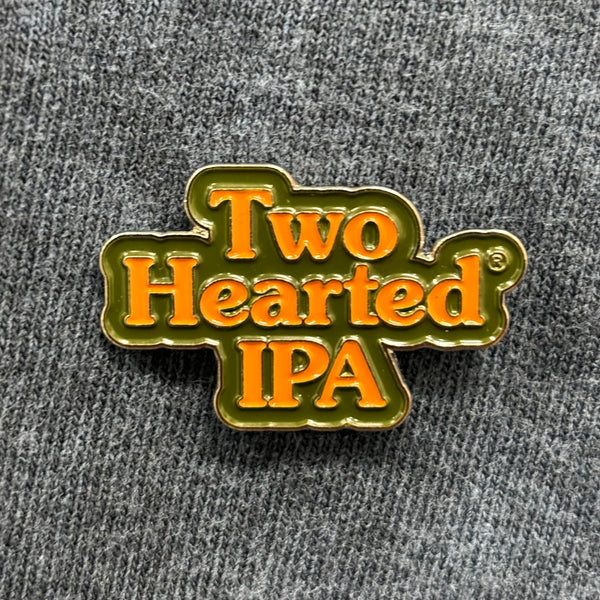 Two Hearted logo on enamel pin.