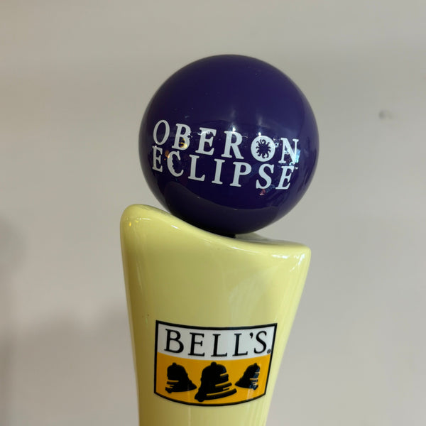 dark blue spherical tap handle globe with "Oberon Eclipse" printed in white letters 