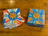 Oberon themed deck of playing cards featuring a sunburst design with orange, blue, yellow, teal, and white around the Oberon sun.