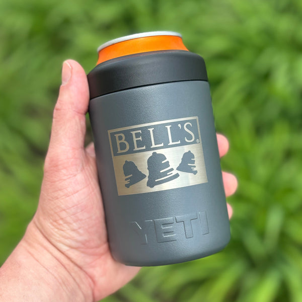 Charcoal colored Yeti brand can insulator featuring an embossed Bell's logo and black screw on top.