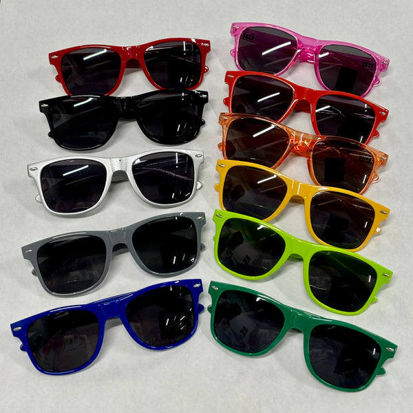 An assortment of colored malibu style sunglasses. In deep red, black, silver, gray, blue, translucent pink, bright red, translucent orange, yellow, lime green, and forest green. All designs feature a black or white bells logo on the temple.  