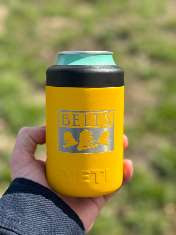 Yellow Yeti brand can insulator featuring an embossed Bell's logo and black screw on top.