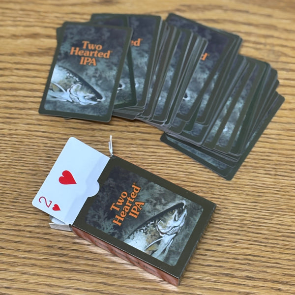 Standard card deck with Two Hearted packaging fish and Two Hearted text in orange.