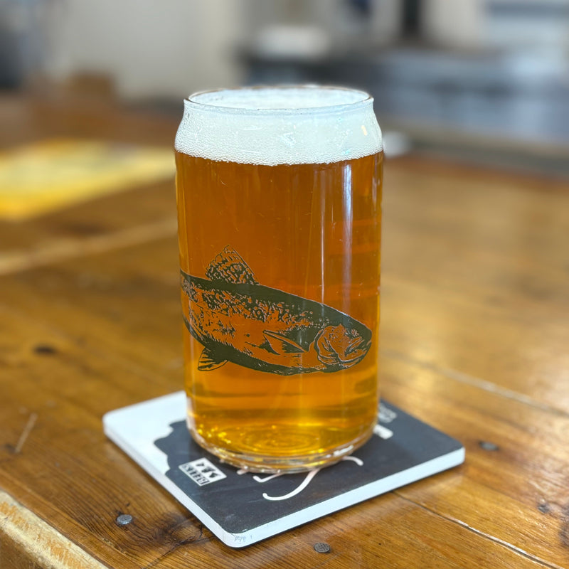 Clear can-shaped glass with Orange and green Bell's logo, Two Hearted IPA text and faded green Two Hearted fish.