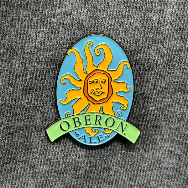 Enamel pin with full color Oberon Sun logo