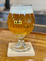 Clear snifter glass with OriginAles text across the lower third and Bell's logo in middle third. Black illustrations of various beer logos around the glass.