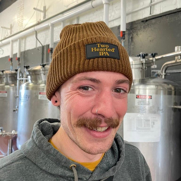 brown beanie featuring black patch with Two Hearted IPA in brown letters