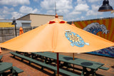 Orange patio umbrella with Oberon Ale logo