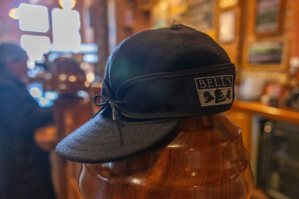 Black stormy kromer style hat with gray Bell's logo embroidered on the side.