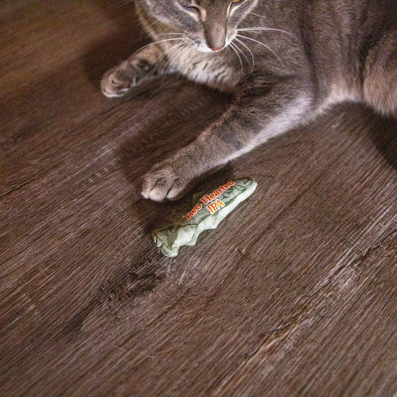 Green Two Hearted Fish-shaped cat toy with "Two Hearted IPA" in orange