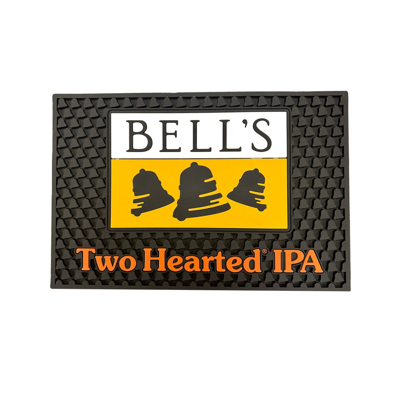 Black bar mat with bell texture featuring large Bell's logo in Yellow, white, and black top center and Two Hearted Ale in orange at the bottom center.