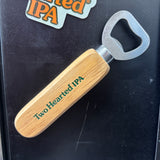 wooden handled bottle opener with magnetic backing and "Two Hearted IPA" in green print on front of handle
