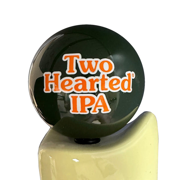 Green beer tap globe feature "Two Hearted IPA" text in orange outlined in white