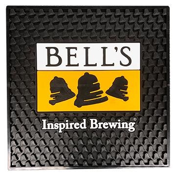 Black server mat with bell texture. Features a yellow, black, and white Bell's logo in the center with "Inspired Brewing" in white centered below the logo.