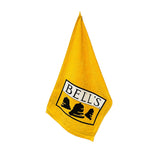 Hanging golden yellow golf towel with Bell's Logo and Inspired Brewing printed on it.