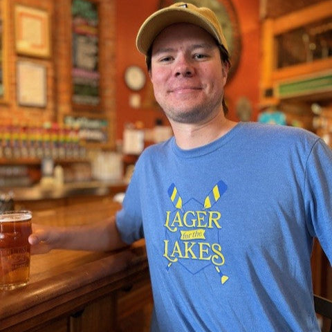 Light blue short sleeve t-shirt with Lager and oars logo on the front. 