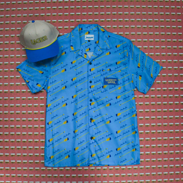 Lager of the Lakes blue button up with waves and oars. Lager rope hat, blue bill with cream base hat and yellow rope. 